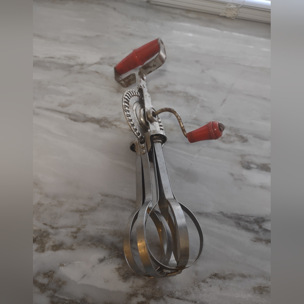 Vintage Handheld Egg Beater with Red Accents